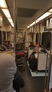 Photo of things blocking the aisle of a VTA light rail car.