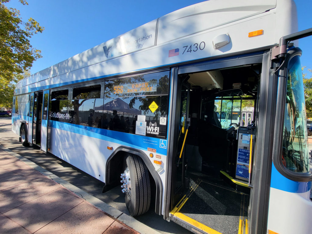 VTA bus 7430, delivered in 2017, made by Gillig of Livermore, awaits departure with both doors open at Gilroy Transit Center.